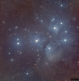 A longer look at the Pleiades reveals the faint dust and tendrils of blue nebulae that interconnect the bright blue stars of this bright cluster.