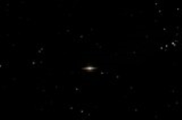 The Sombrero Galaxy features a bright core illuminated by over 2,000 globular clusters and presents a dark dust lane in the edgewise view of the spiral.