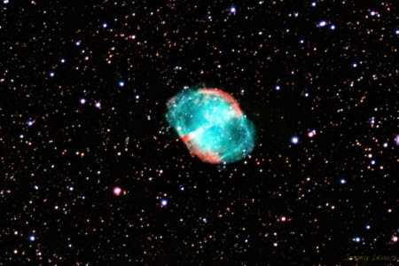 The Dumbbell Nebula, designated Messier 27, was discovered in 1764. It is the first so-called 'planetary nebula' to be discovered. The name comes from the round shape that resembles a planet. What you see is the outer layers of an old star that were shed and are expanding in waves of hydrogen, sulfer, and oxygen. 