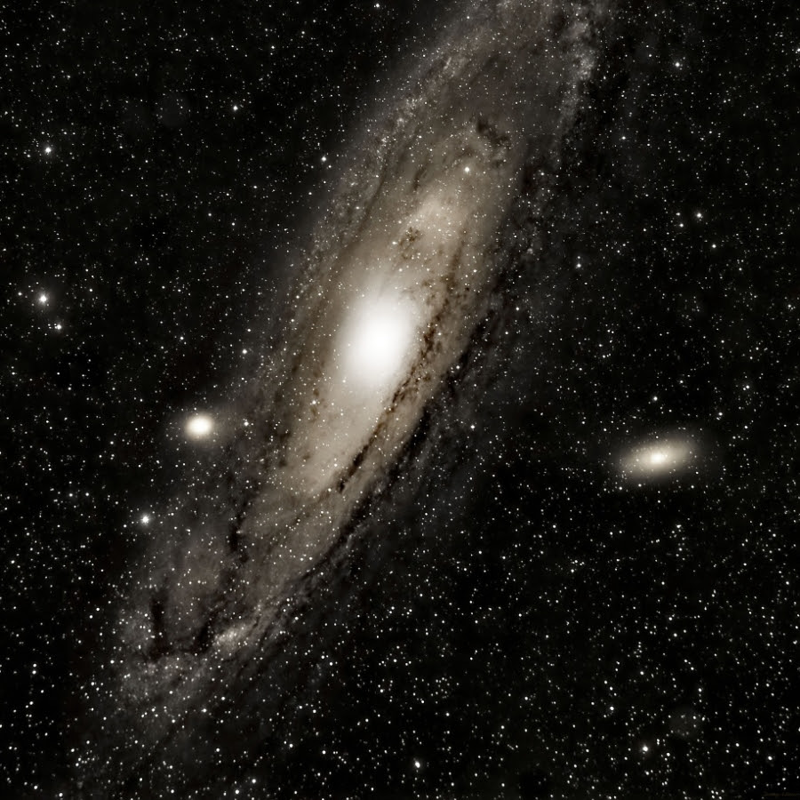 The Andromeda Galaxy is our closest neighboring galaxy. It has two visual neighbors that appear as fuzzy disks: M32 and M110. It is such a large target that producing this much detail typically requires stitching multiple pictures together. For this shot, I rented a premimium telescope located in Spain and remote-controlled it to capture 19 frames with red, green, and blue filters that were recombined to produce the result you  see.