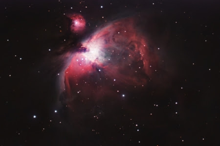 In February 2020, I set a telescope I just purchased outside my house and provided it with instructions to take pictures of an area in the sky. The target I chose was M42, the Great Orion Nebula. The intricate structure known as a diffuse nebula spans 24 light years of space. It is the closest known area of active star formation to earth at an estimated 1,300 light years away. The energy it emits earns its spot as the brightest nebula in the night sky. The glowing 'heart' is illuminated by four brilliant stars referred to as 'the Trapezium' beanth a flowing 'scarf' of dark gas that separates M42 from 'the head' or M43, Mairan's Nebula. This continues to be my favorite target. It is one of the first nebulae I photographed and the first print I ever made.