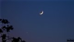 A dusk meeting between Venus and the moon.