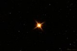 Brilliant orange Betelgeuse is a red supergiant that adorns Orion's shoulder and is one of the lagest stars the human eye can perceive. In our solar sytem, the edge of Betelgeuse would extend beyond the orbit of Mars.