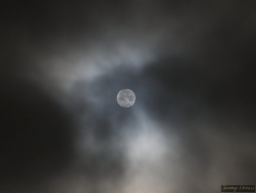 A cloudy view of the moon.