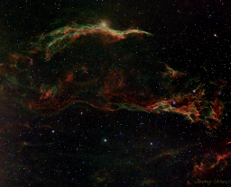 The Cygnus Loop is a massive structure of supercharged gas expanding rapidly from the center of a supernova in the distant past. This image captures the Veil Nebula or Witch's broom end and used a narrowband filter to enhance the detail.