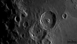 Craters Cyrillus (left) and Theophilus (right) both contain features including other craters ('sub' craters) and peaks. The largest peak in Theophilus rises to 2.8 kilometers or about 1 3/4 miles tall.