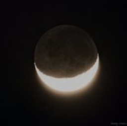 A crescent moon with details of the dark parts revealed.
