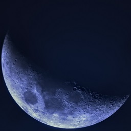 An image of the moon captured during the day, several hours before sunset.