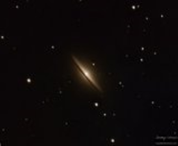 An edge-on view of the barred spiral galaxy that celebrates on Cinco de Mayo.