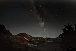 The Milky Way arching over a peak capped by the Lyman Glacier.