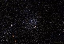 This sprinkling of light and dark stars is an open cluster near Cassiopeia.
