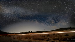 The Milky Way rises over the horizon across from the Hornbeck Homestead in Florissant, Colorado.