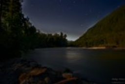 A view of the Skykomish River under extremely bright moonlight.