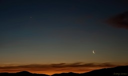 A dawn view of Venus with a crescent moon.