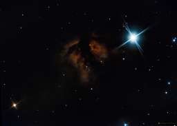 The star ζ Orionis (Alnitak) is the leftmost star on the constellation Orion's belt. It is a triple star system hosted by a blue supergiant. Next to it bursts the Flame Nebula, an emission nebular supercharged by ultraviolet rays emanating from Alnitak. Often grouped with the more iconic Horsehead Nebula (IC434), the Flame stands well on its own.