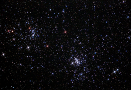 A bright and colorful grouping of two clusters that span a section of the sky twice the size of a full moon.