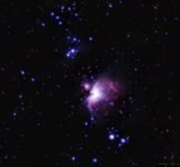 The purple running man hangs suspended above the red-cloaked Great Orion Nebulae. M42, M43, and NGC1977 together in the same frame!