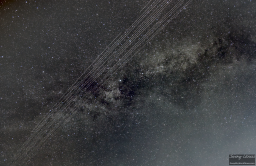 A Starlink satellite train is an eerie thing to witness. It looks like a string of pearls or white dots moving in a straight line that terminates in earth's shadow. This is the first time I caught one on camera. This is 5 45-second exposures stacked together.