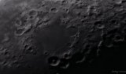 A detailed, wide angle close up of the moon's surface.