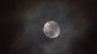 A video of the last supermoon of 2023 appearing in a cloud sky following by the morning sun from the following day.